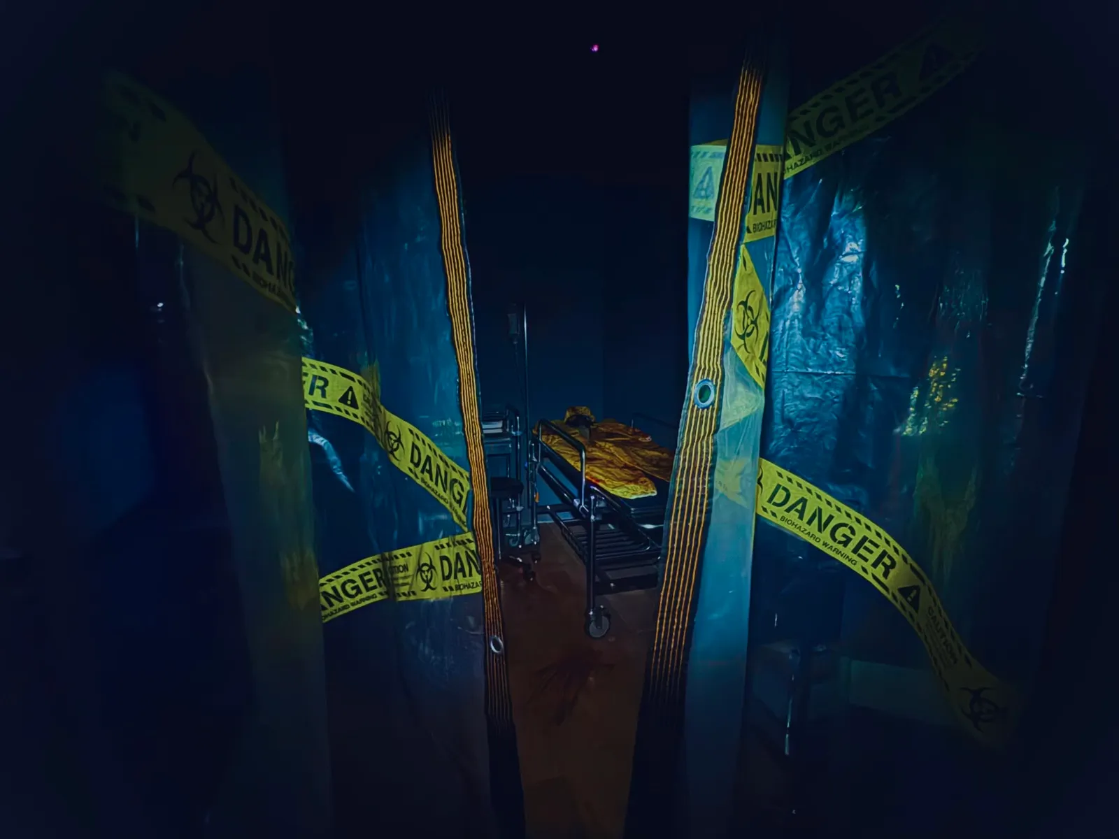The hazard-taped laboratory set inside the Bearsident Evil escape room at Marina Square