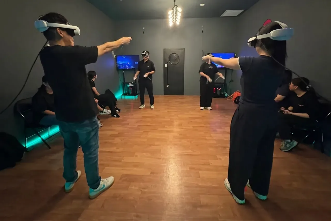Two players in VR headsets facing off across the free-roam VR floor at Lockdown Marina Square